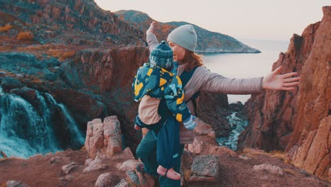 family hike in arctic. mother hikes with her toddler daughter in the arctic area near teriberka town in russia