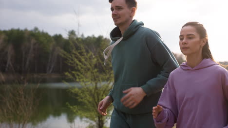 couple running in the forest