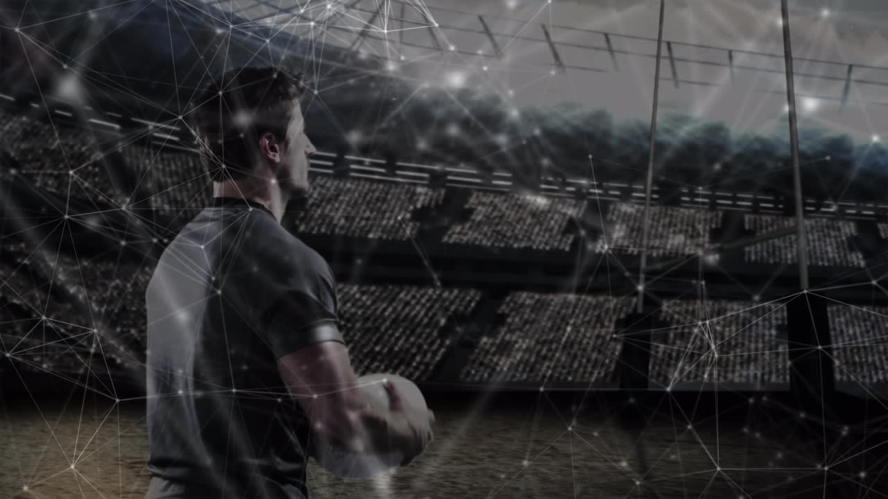 Animation of network of connections over rugby player holding ball at stadium