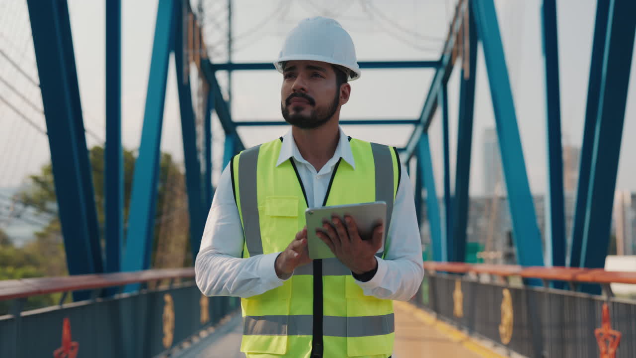 Engineer Inspecting Bridge with Tablet