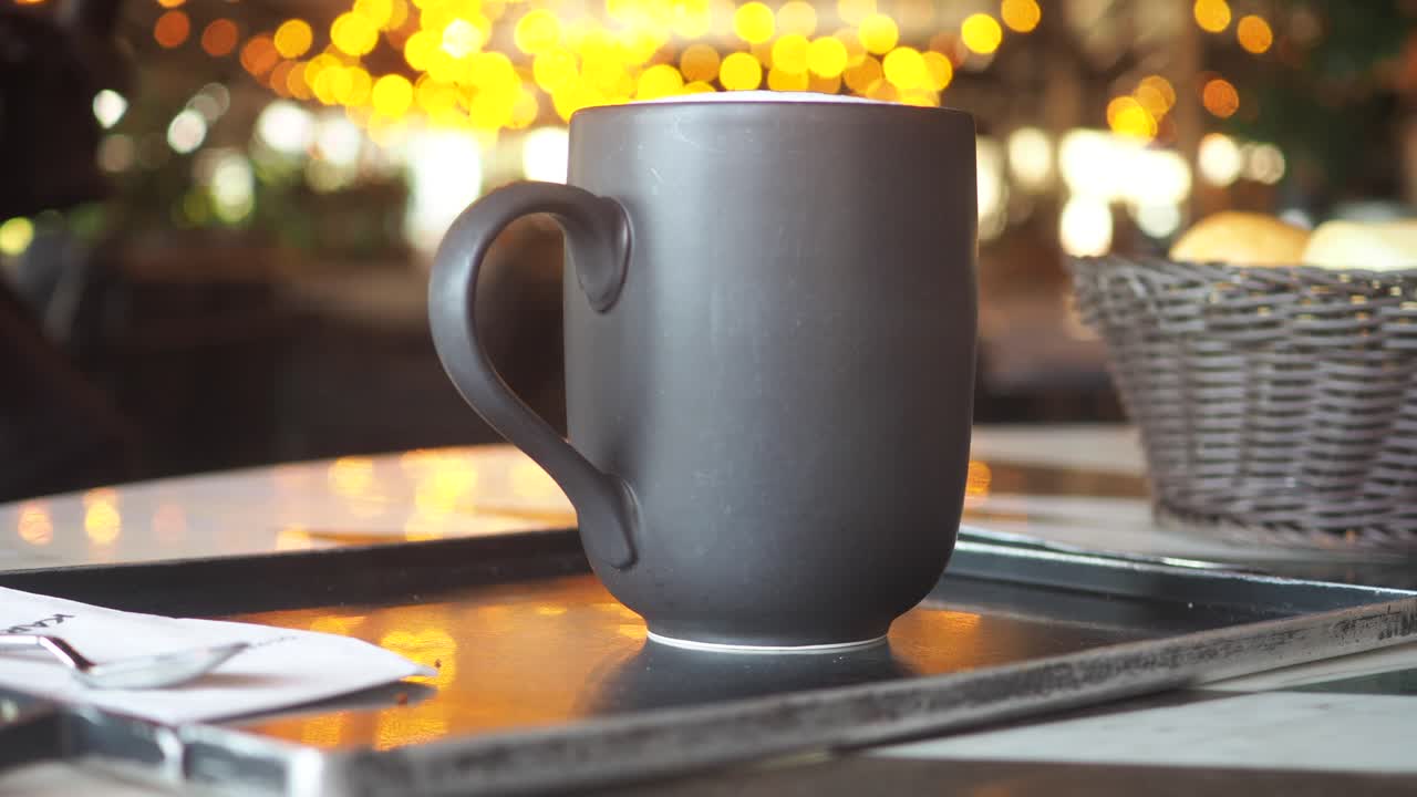 Coffee mug on a table in a restaurant