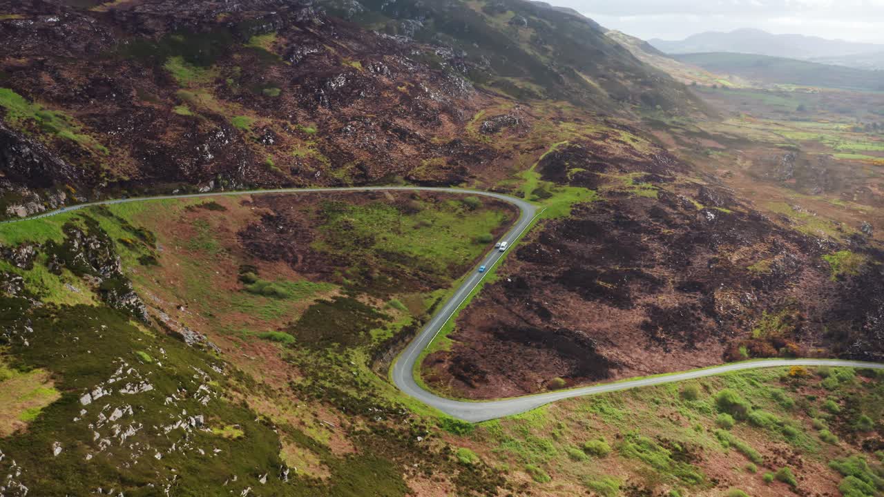 Aerial View of Cars Overtaking a Van on Winding Mountain Road in Donegal