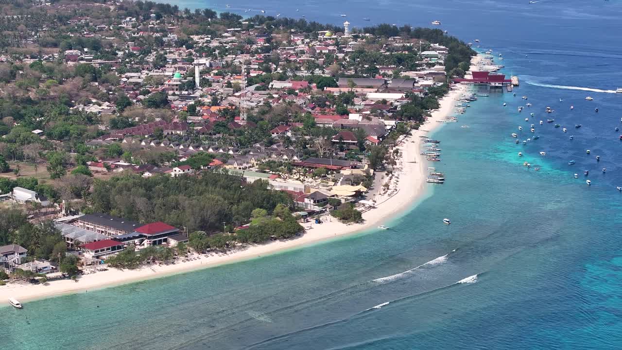 Gili Trawangan Island in Indonesia. Aerial view of settlement and main white sandy beach with port.