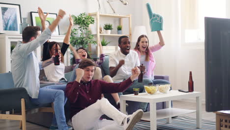 friends watching sports game