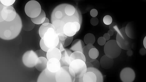 animación de puntos de luz y formas sobre fondo negro