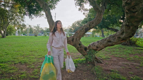 conscious girl picking trash demonstrating environmental responsibility.