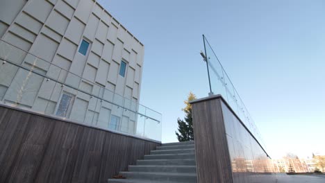 steps and ground with glass railings by stylish building