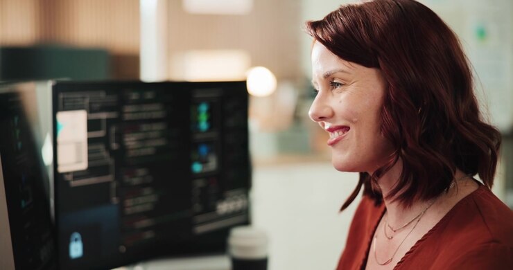 Professional Woman Working on Computer in Modern Office