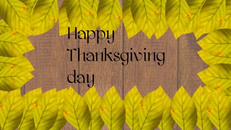 Happy-thanksgiving-day-text-and-frame-of-autumn-leaves-against-wooden-background