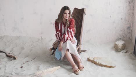 beautiful-young-woman-in-an-embroidered-authentic-Ukrainian-shirt-and-skirt-poses-and-adjusts-her-hair-while-looking-into-the-camera