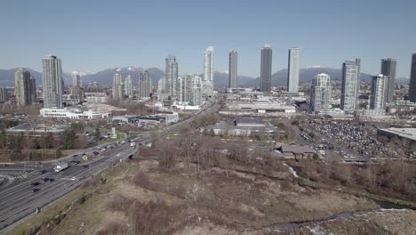 Burnaby-highway-with-skyscrapers-in-background,-Lower-Mainland-region-of-British-Columbia,-Canada