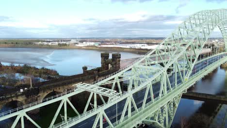 charity santa dash fun run over runcorn silver jubilee bridge aerial view pull away reveal