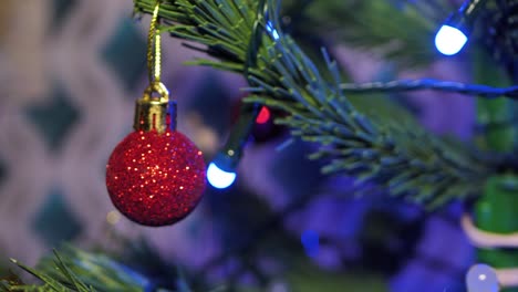 The-Christmas-artificial-Christmas-tree-rotates-with-lights,-Christmas-lights