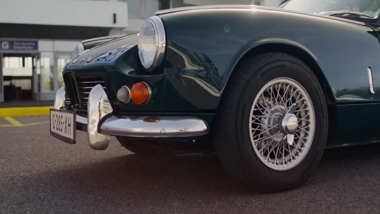 Vintage Convertible Cars at an Airport
