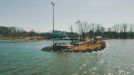 Drone-orbiting-around-a-lake-dock-on-a-beautiful-sunny-day