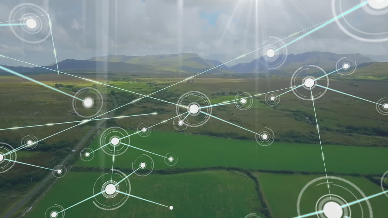 Network of connections and data processing animation over lush green landscape