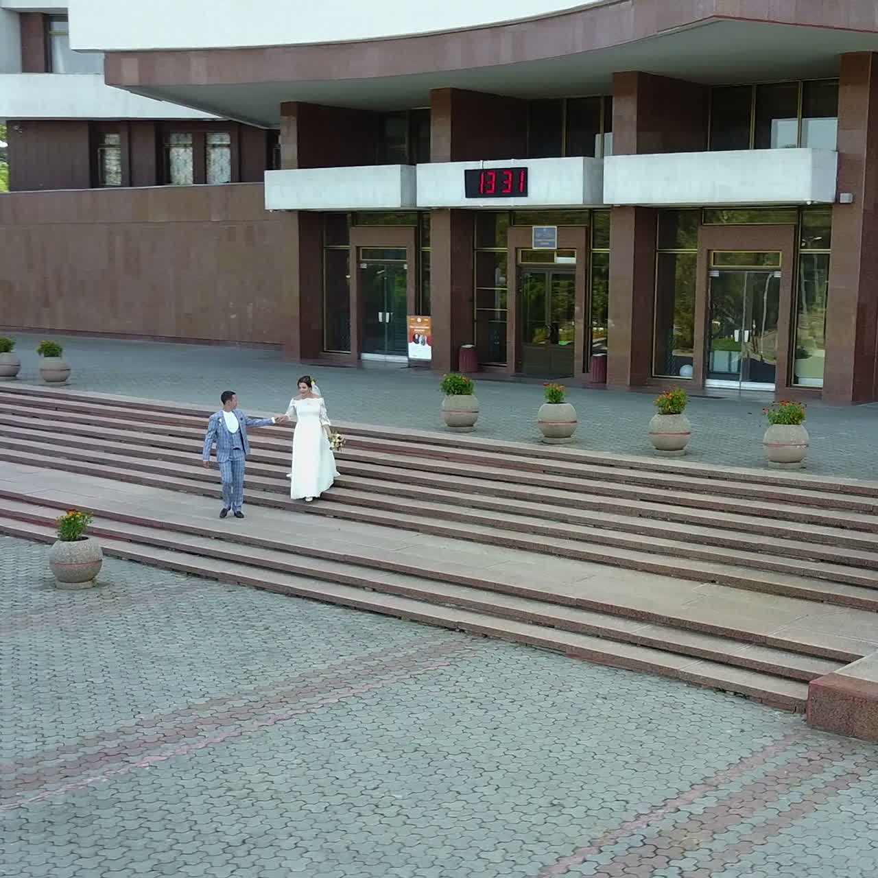 Walk of the newlyweds through the streets of the city. Aerial view Square video