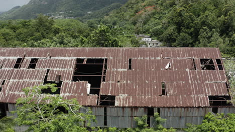 old rusty and rotting metal roof on an abandoned factory in puerto rico