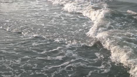 waves-of-sea-water-that-wash-the-beach-sand-in-the-afternoon