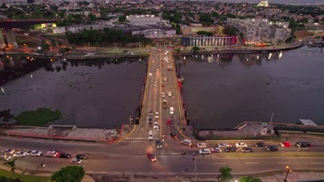 Aerial-Shot-of-Floating-Bridge-over-Ozama-River-in-Colonial-City-of-Santo-Domingo,-Dominican-Republic