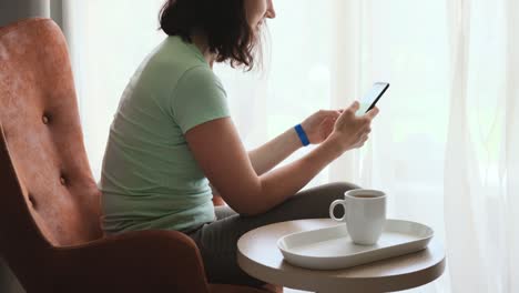 woman working online in the morning in hotel room or bedroom