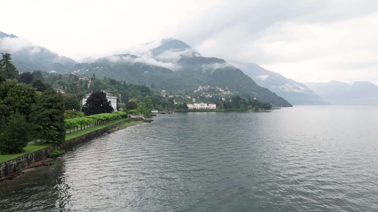 Flying along lake como revealing the famous luxury wedding Venue Villa Melzi d´Eril in Bellagio italy at in its neoclassical architecture revealing the nature and gardens