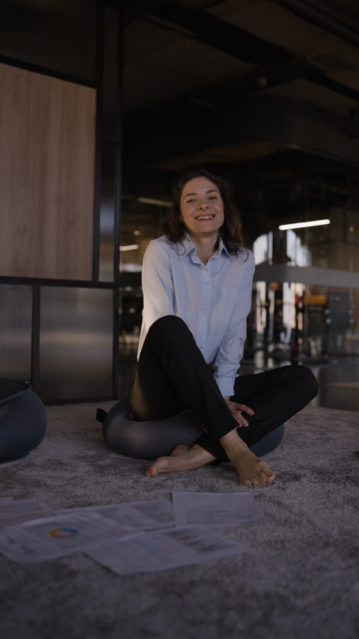 Businesswoman reviewing reports in a modern office