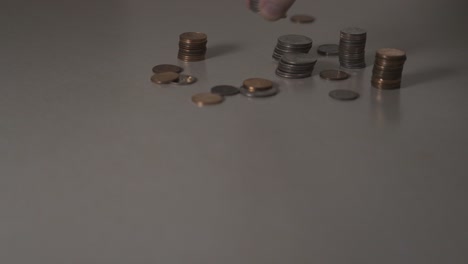 picking up an organized stack of american quarters