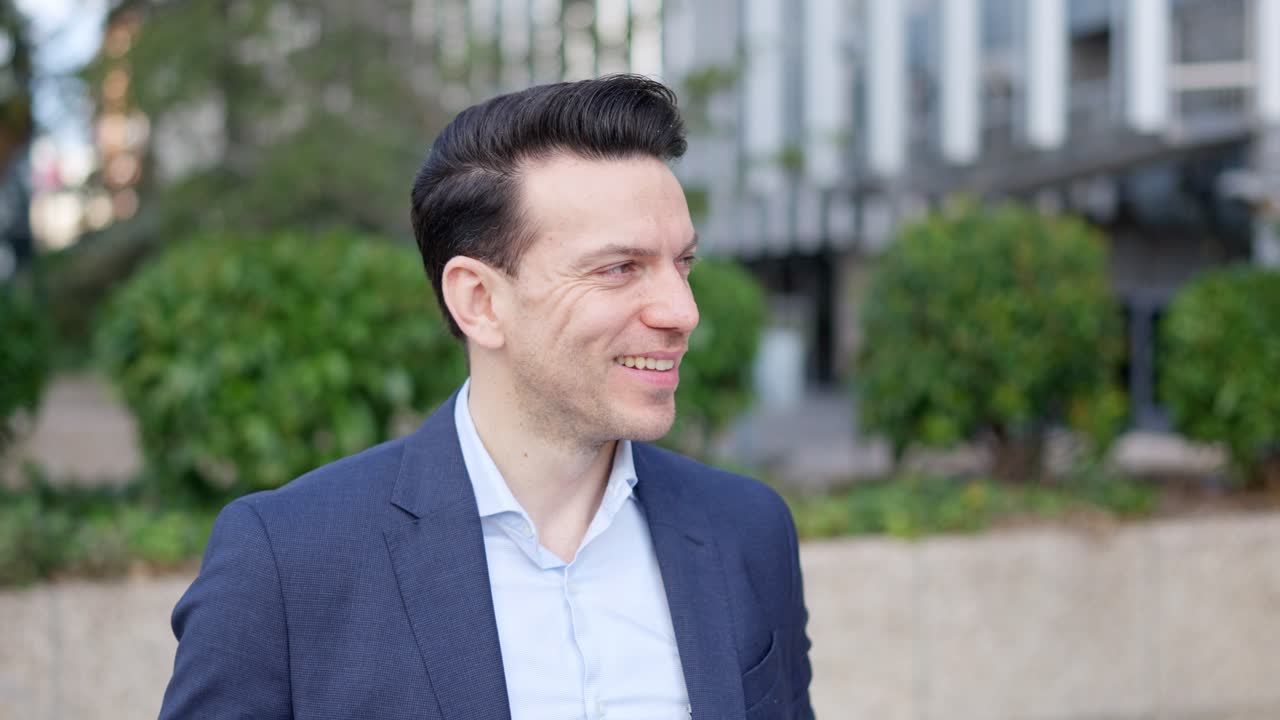 Smiling Professional Man in a Suit Outdoors