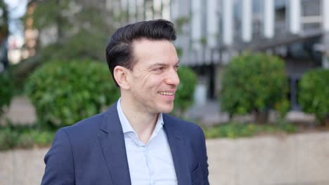 smiling professional man in a suit outdoors