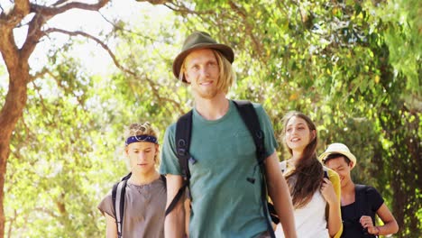 friends walking together in park 4k