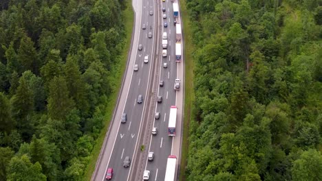 Zoomed-inEmergency-lane-forming-on-a-2-lane-highway-due-to-traffic-accident-with-heavy-traffic-making-congestion-in-a-small-European-country-from-a-drone