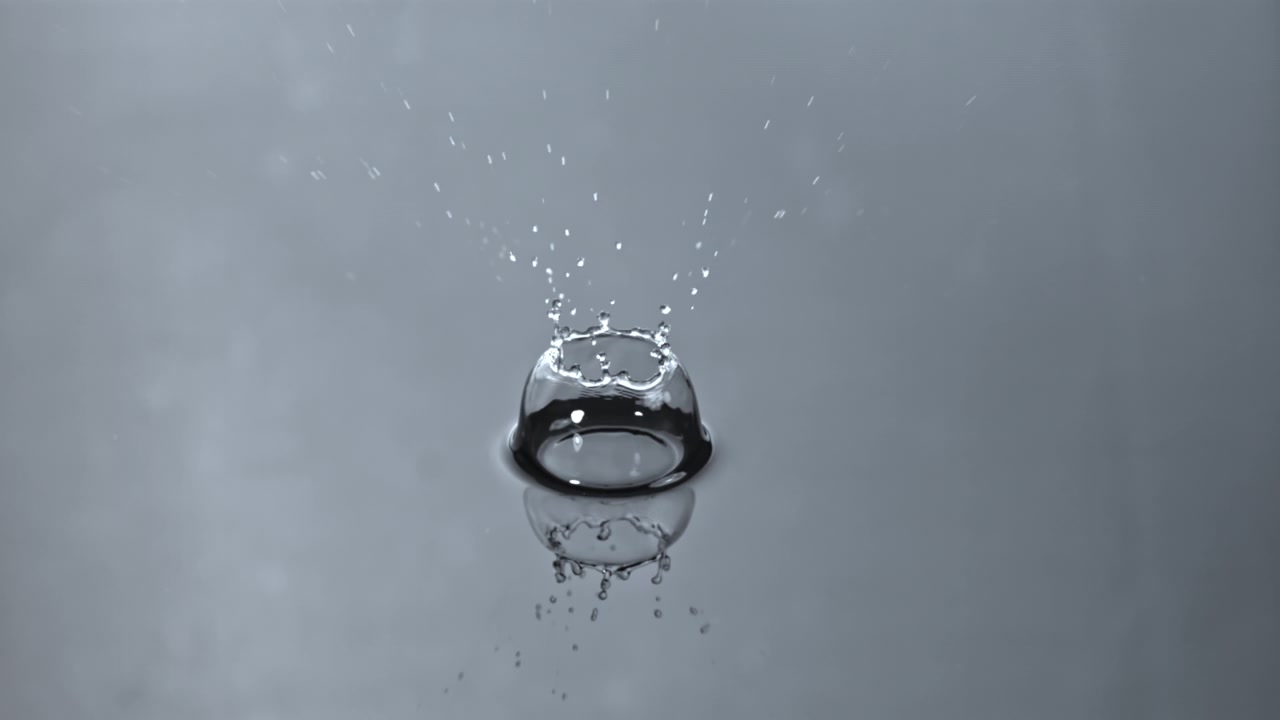 Slow Motion Water Drop Splashing and Forming Ripples