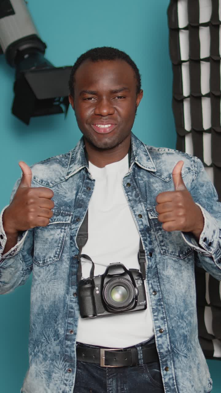Portrait of a photographer giving thumbs up
