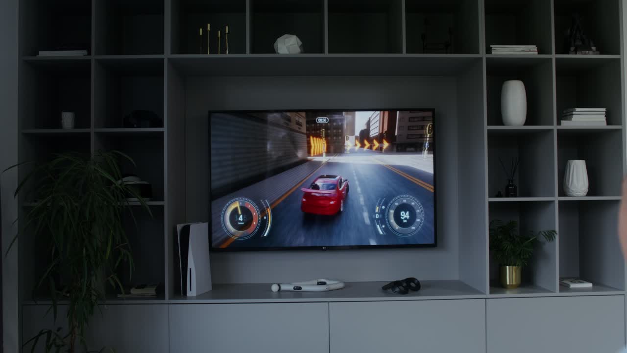 Person playing a racing game on TV