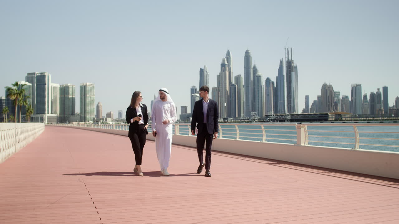 Three people talking about business