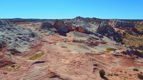 Take-off-drone-shot-of-White-Pocket-at-the-Vermillion-Cliffs-National-Monument,-Arizona-United-States