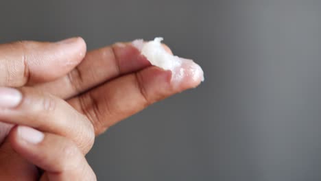 Close-up-of-man-hand-using-petroleum-jelly