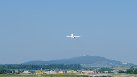 rear of airbus a330 taking off from zurich airport in switzerland