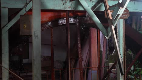 rustic industrial water wheel in operation