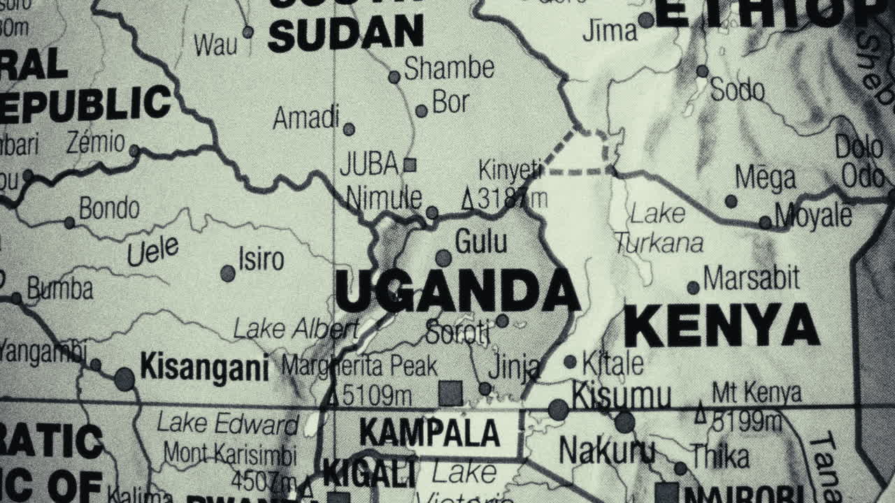 A monochromatic map showing East African countries like Uganda, Kenya, and South Sudan