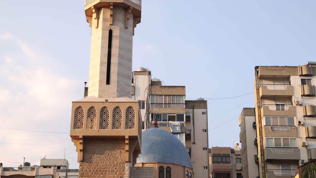 panning up shot on modern minaret in the city of Tripoli, Northern Lebanon