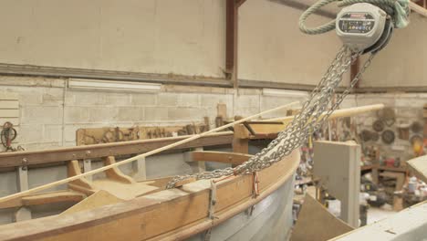 shipwright's boatshed clinker built sailboat under construction