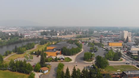 4K-Drone-Video-of-Morris-Thompson-Cultural-Center-and-Old-Steese-Highway-Bridge-on-the-Chena-River-in-Downtown-Fairbanks,-Alaska-on-Summer-Day