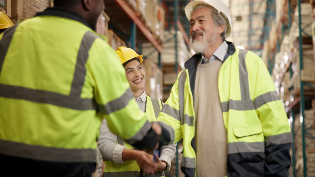 Warehouse workers discussing inventory