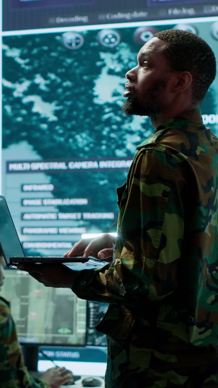 Vertical Video Military officers work in a high tech army control tower base