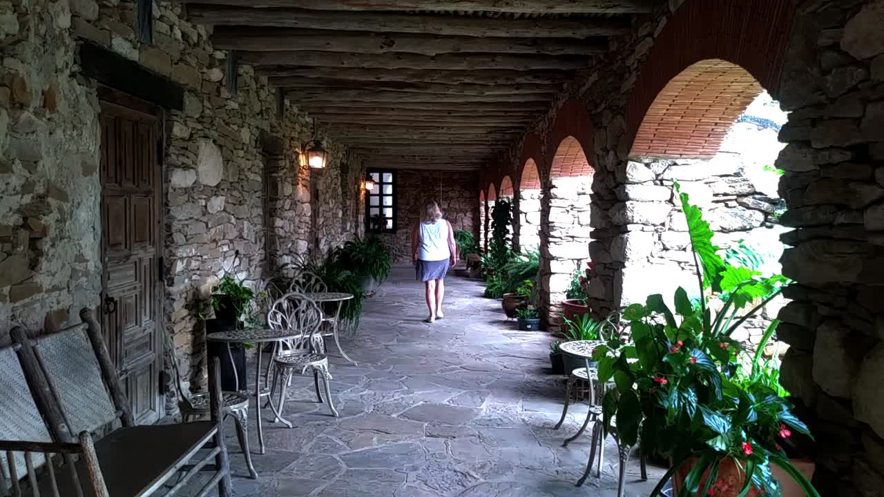 walking by the arches of a old mission in Texas