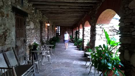walking by the arches of a old mission in texas