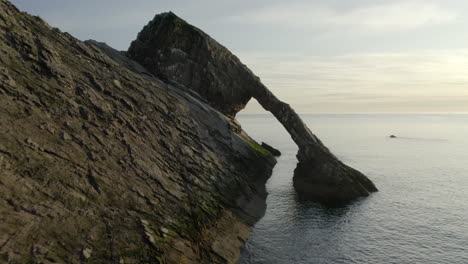 An-aerial-view-of-Bow-Fiddle-Rock-at-Portknockie-on-a-calm-summer's-morning