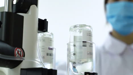 female lab technician doing forensic research experiment, scientific experiments in a chemistry laboratory